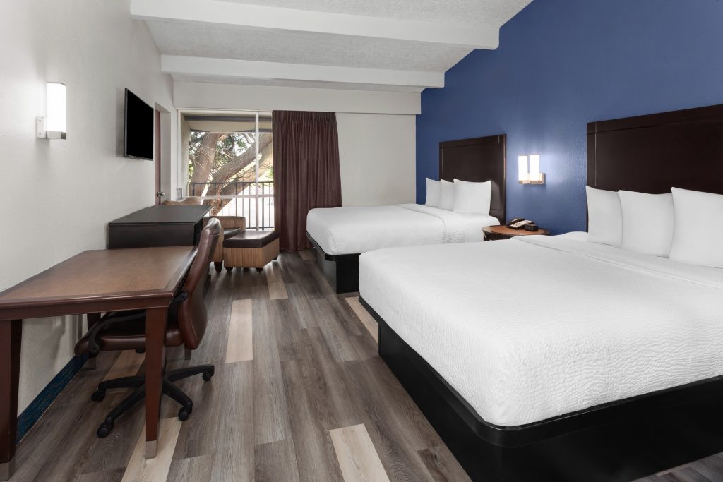 Two queen beds guest room at Travelodge by Wyndham Milwaukee