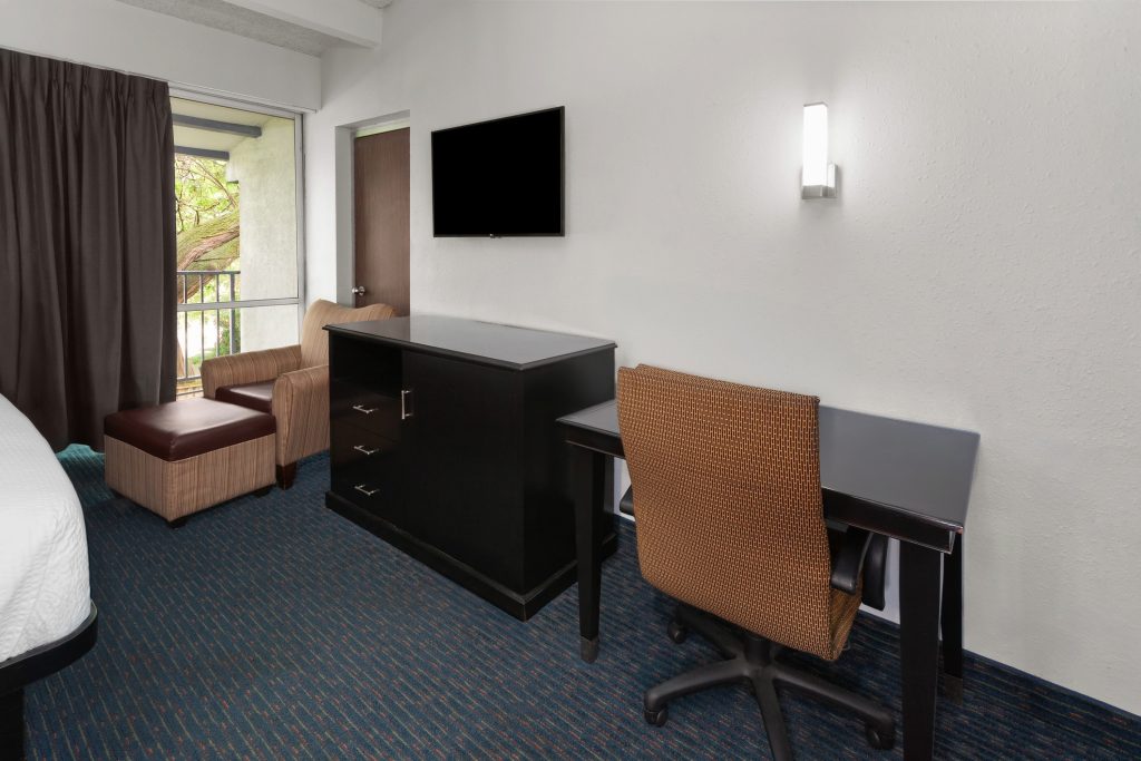 King bed in the studio suite at Travelodge by Wyndham Milwaukee