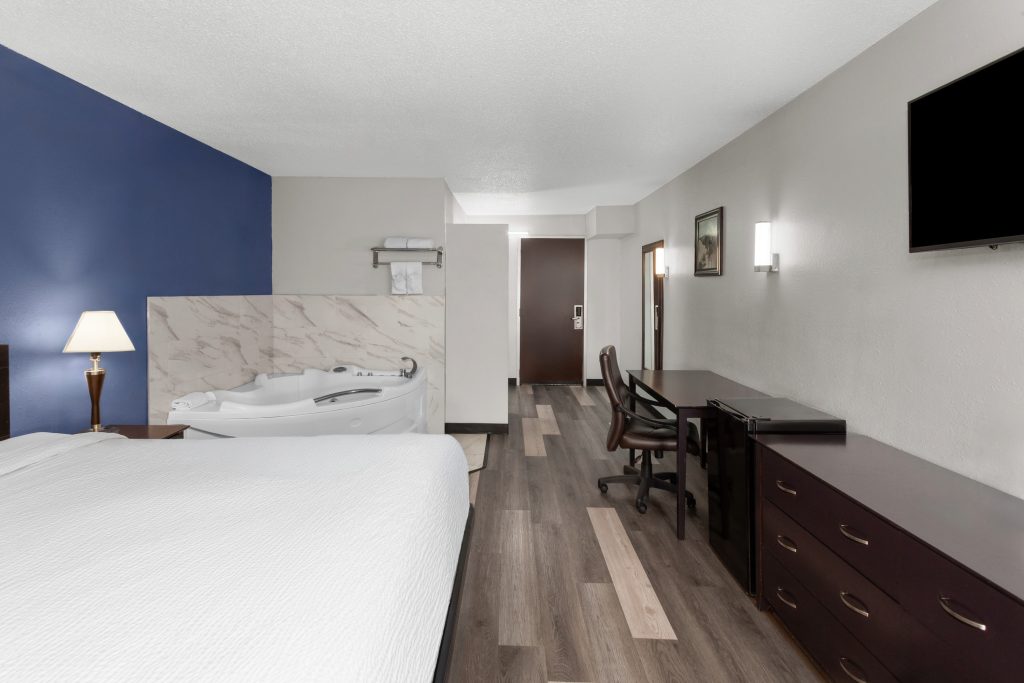 Deluxe king studio suite with whirlpool tub at Travelodge by Wyndham Milwaukee