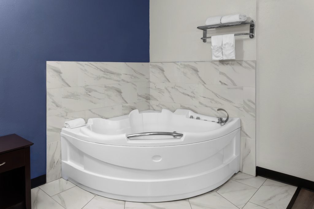 In-room jetted hot tub in the deluxe king studio suite at Travelodge by Wyndham Milwaukee